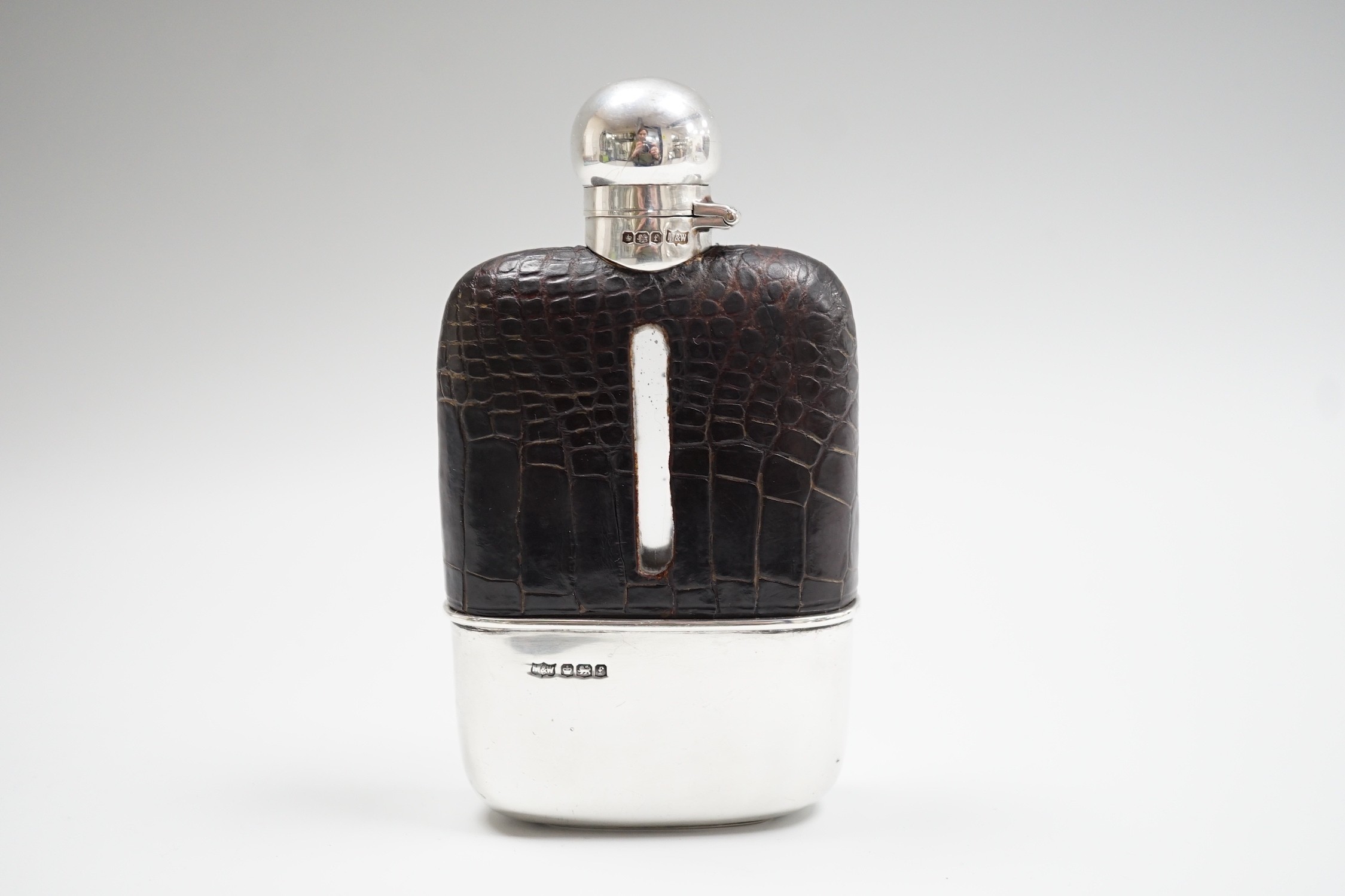 A George V silver and leather mounted glass hip flask, Mappin & Webb, Sheffield, 1923, 15cm.